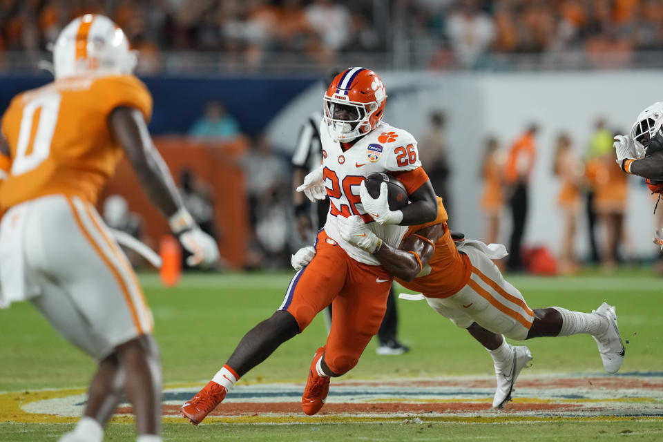 Clemson running back Phil Mafah (26) is tackled by Tennessee linebacker Solon Page III during the first half of the Orange Bowl NCAA college football game Friday, Dec. 30, 2022, in Miami Gardens, Fla. (AP Photo/Rebecca Blackwell)