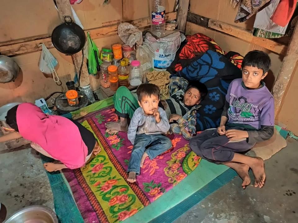 Saby Kanoor preparing food for her younger brothers at a refugee camp.