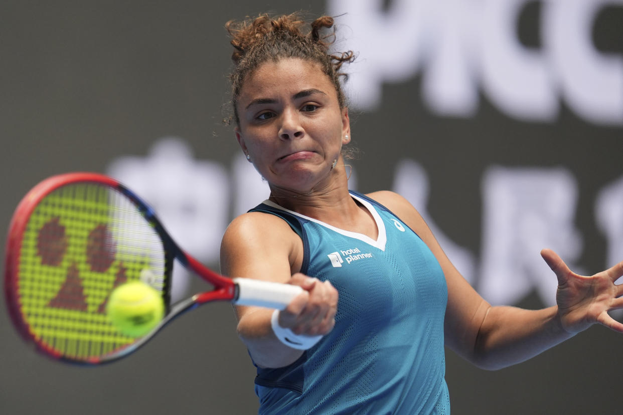 Jasmine Paolini of Italy returns a shot from Clara Tauson of Denmark during the China Open tennis tournament held at the National Tennis Center in Beijing, Saturday, Sept. 28, 2024. (AP Photo/Ng Han Guan)