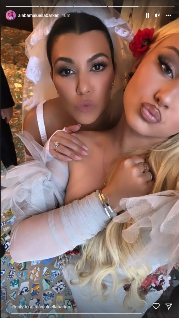 Kourtney Kardashian Wears White with Travis Barker's Daughter Alabama in First Photo from Wedding. https://www.instagram.com/alabamaluellabarker/.