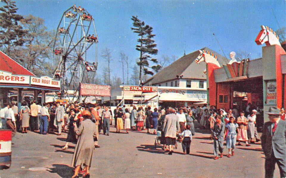 A vintage photo postcard depicts the midway at Lincoln Park in Dartmouth.
