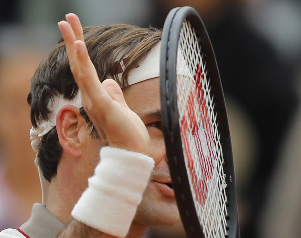 Switzerland's Roger Federer celebrates winning in three sets 6-2, 6-4, 6-4, against Italy's Lorenzo Sonego during their first round match of the French Open tennis tournament at the Roland Garros stadium in Paris, Sunday, May 26, 2019. (AP Photo/Michel Euler )