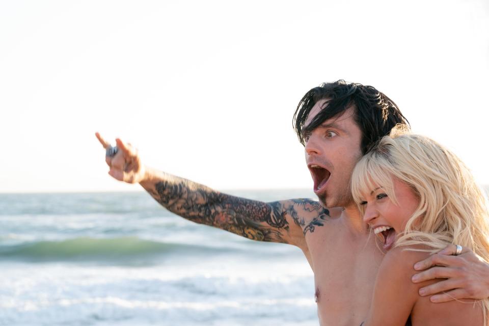 close up of a man and a woman on the beach