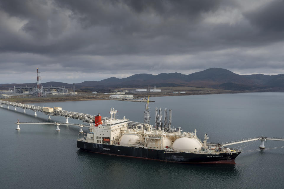 FILE - The tanker Sun Arrows loads its cargo of liquefied natural gas from the Sakhalin-2 project in the port of Prigorodnoye, Russia, on Friday, Oct. 29, 2021. Japan’s industry minister said Friday, Nov. 4, 2022, that a Japanese consortium has decided to retain its stake in the new Russian operator of the Sakhalin-1 oil and gas project and is set to notify Moscow by the deadline, a move to secure stable energy supply for the resource-scarce country. (AP Photo, File)