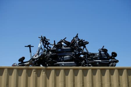 Some of the thousands of BIRD scooters are shown at Scoot Scoop after the company impounded the devices when contracted by private property owners who no longer want them being left on their property in San Diego, California