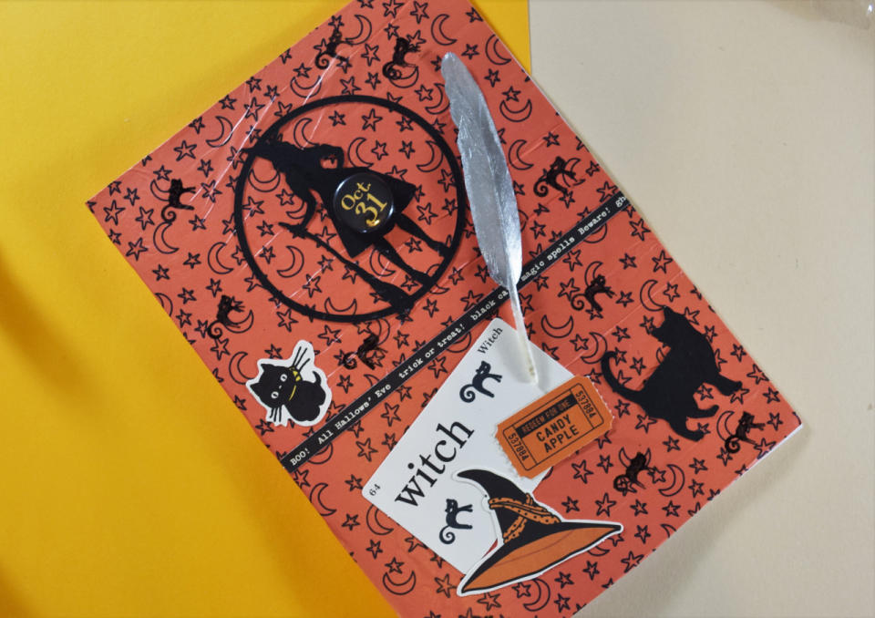  To finish the card, I used a cat stamp to add some more detail to the front and I stuck on a Halloween badge that I found. Share your creations with us on Twitter @YahooStyleUK.