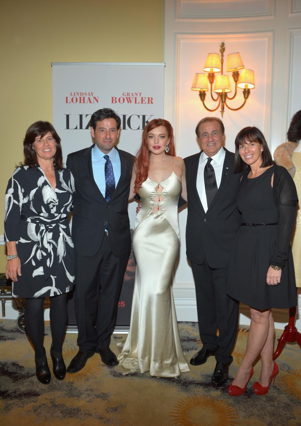 BEVERLY HILLS, CA - NOVEMBER 20: (L-R) Lifetime SVP Original Movies Tanya Lopez, Lifetime EVP Programming Rob Sharenow, actress Lindsay Lohan, executive producer Larry Thompson, and Lifetime VP Original Movies Nancy Bennett attend a private dinner for the Lifetime premier of "Liz & Dick" at Beverly Hills Hotel on November 20, 2012 in Beverly Hills, California. (Photo by Charley Gallay/Getty Images for A&E Networks)