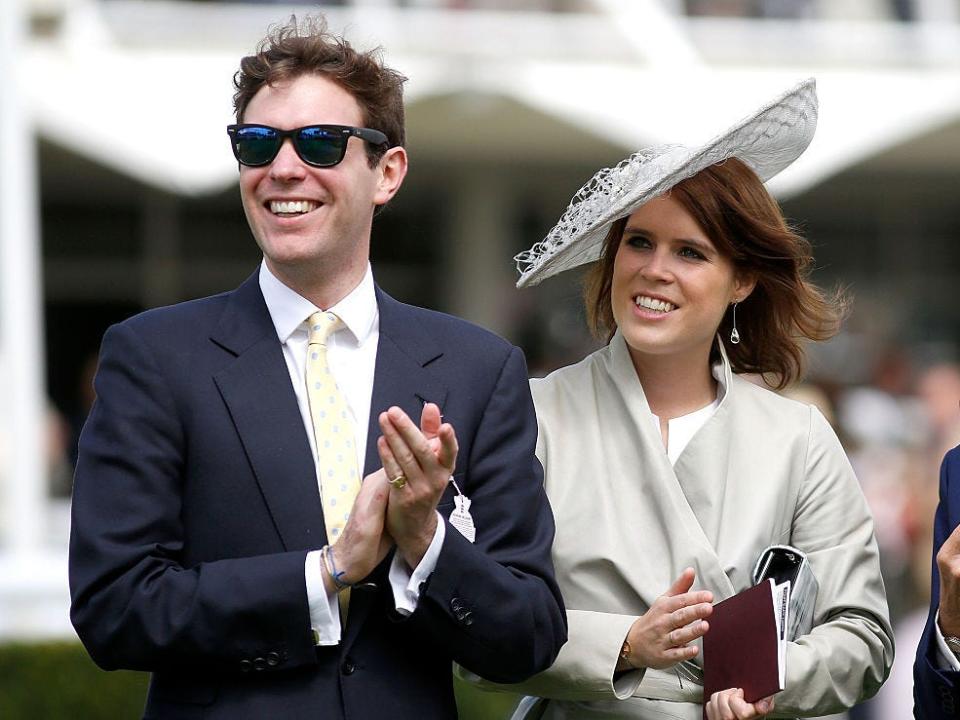 Princess Eugenie and Jack Brooksbank smile at the Qatar Goodwood Festival in Chichester in 2015.