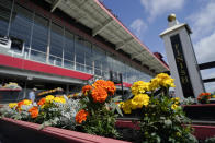 Flowers adorn an area near the finish line ahead of the Preakness Stakes horse race at Pimlico Race Course, Thursday, May 19, 2022, in Baltimore. (AP Photo/Julio Cortez)