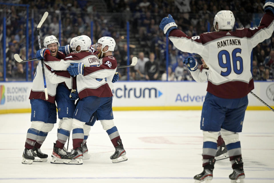 The Colorado Avalanche celebrate their overtime win over the Tampa Bay Lightning in Game 4 of the NHL hockey Stanley Cup Finals on Wednesday, June 22, 2022, in Tampa, Fla. (AP Photo/Phelan Ebenhack)