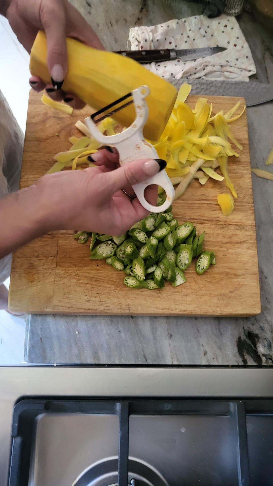 Chef Alison Settle peeled baby butternut squash into ribbons for a summer salad and cut okra for searing.