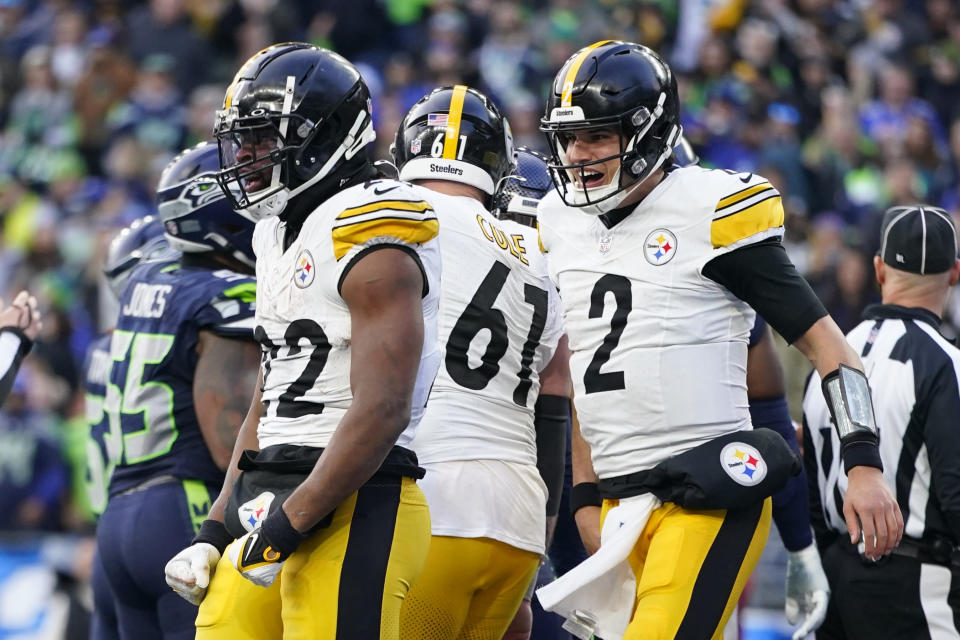 Pittsburgh Steelers running back Najee Harris (22) celebrates with quarterback Mason Rudolph (2) after Harris scored a touchdown against the Seattle Seahawks in the second half of an NFL football game Sunday, Dec. 31, 2023, in Seattle. (AP Photo/Lindsey Wasson)