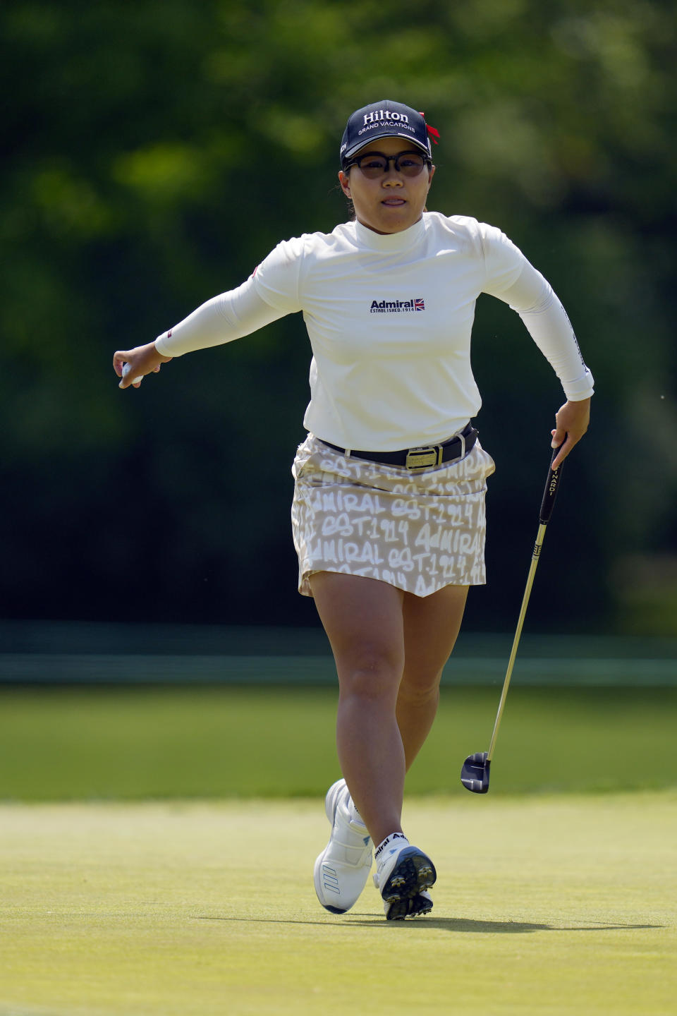 Nasa Hataoka, of Japan, reacts after sinking a putt on the 14th green during the first round of the LPGA Cognizant Founders Cup golf tournament, Thursday, May 11, 2023, in Clifton, N.J. (AP Photo/Seth Wenig)