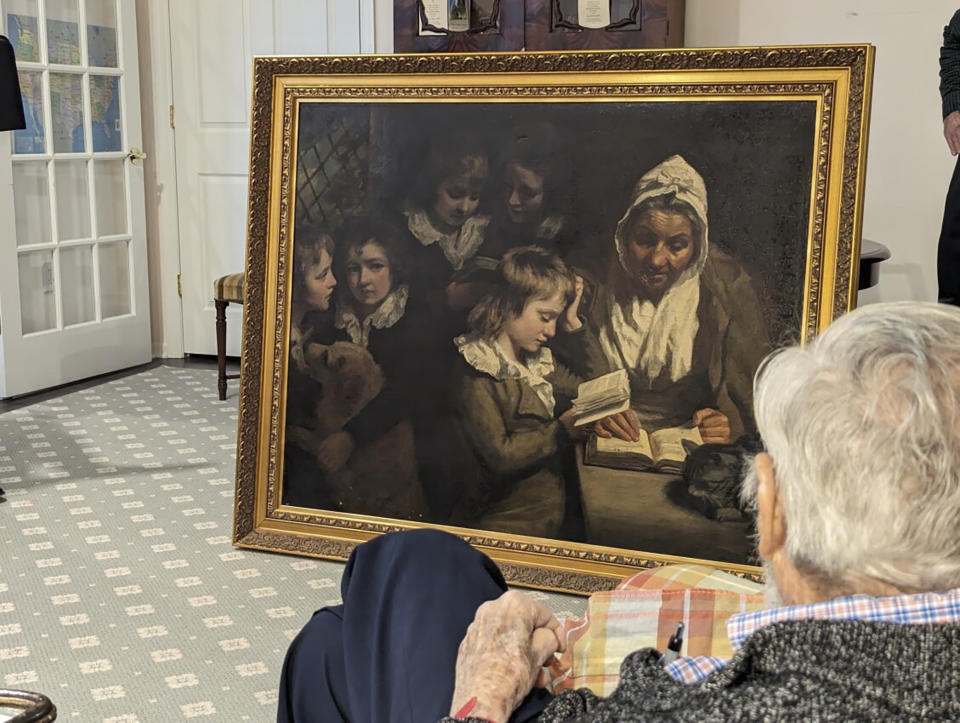 Dr. Francis Wood, 96, admires the John Opie painting, "The Schoolmistress", that was stolen from his parents' Newark, N.J. home in 1969 and recently returned to him on Thursday, Jan. 11, 2024. The 18th-Century John Opie painting stolen by mobsters in 1969 with help from a New Jersey state lawmaker has been returned more than 50 years later, the FBI’s Salt Lake City field office announced Friday, Jan. 26. (FBI via AP) (FBI via AP)