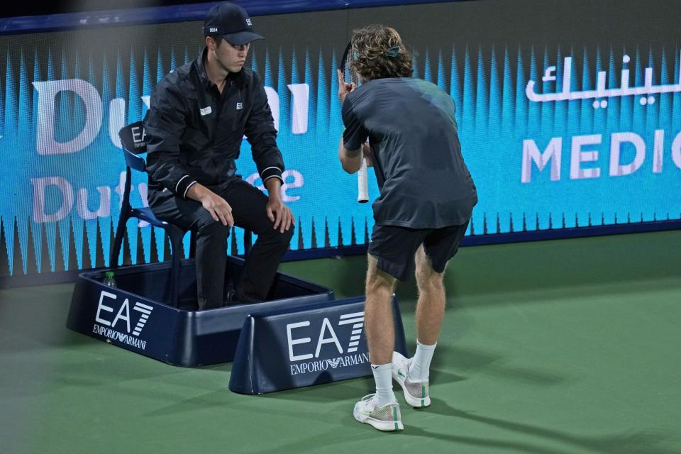 FILE - Andrey Rublev reacts in front a linesman during his semifinal match with Alexander Bublik of Kazakhstan at the Dubai Duty Free Tennis Championships in Dubai, United Arab Emirates, Friday, March 1, 2024. Rublev appealed his default and the ATP ruled Monday, March 4, he will be allowed to keep his rankings points and prize money from the tournament, minus a $36,400 fine for unsportsmanlike conduct after he appealed the punishment of his default from the semifinals for yelling in the face of a line judge last week.(AP Photo/Kamran Jebreili, File)