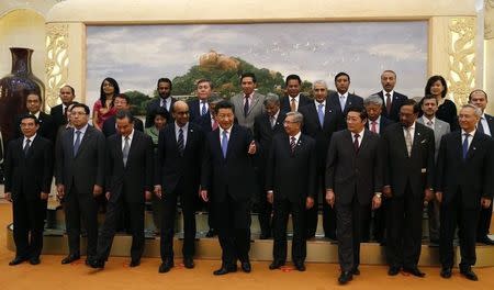 China's President Xi Jinping (front C) guides guests at the Asian Infrastructure Investment Bank launch ceremony at the Great Hall of the People in Beijing October 24, 2014. REUTERS/Takaki Yajima/Pool