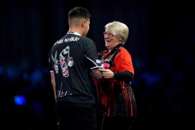 Lisa Ashton (right) congratulates Ryan Meikle on his victory during day three of the Cazoo World Darts Championship at Alexandra Palace