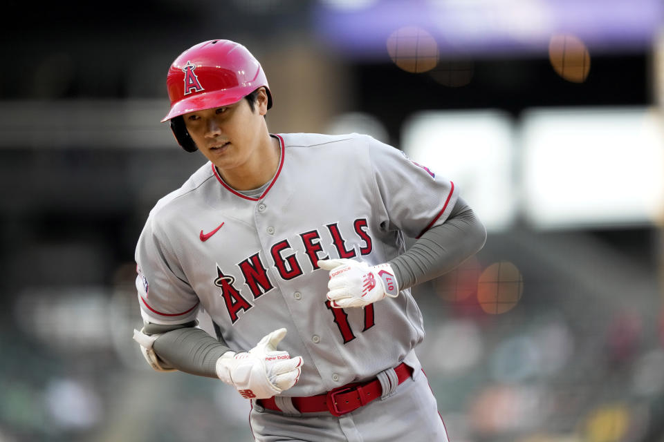 Los Angeles Angels' Shohei Ohtani returns to the dugout after he flied out during the first inning of the team's baseball game against the Chicago White Sox on Tuesday, May 30, 2023, in Chicago. (AP Photo/Charles Rex Arbogast)