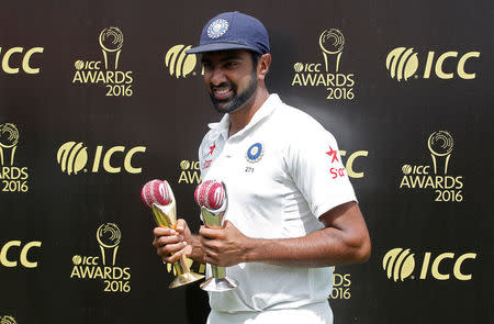 Cricket - India v Australia - Fourth Test cricket match - Himachal Pradesh Cricket Association Stadium, Dharamsala - 28/03/17 - India's Ravichandran Ashwin, who won the International Cricket Council's (ICC) Cricketer of the Year and Test Cricketer of the year award, poses with the trophies during the award ceremony. REUTERS/Adnan Abidi