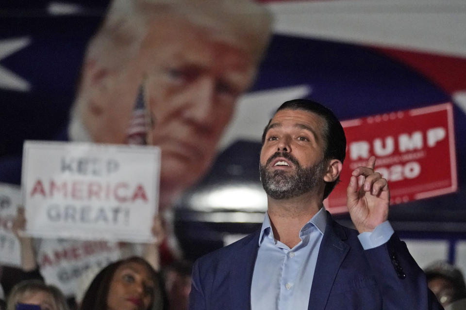 FILE - In this Nov. 5, 2020, file photo Donald Trump Jr., gestures during a news conference at Georgia Republican Party headquarters in Atlanta. A spokesman says President Donald Trump’s eldest son, Donald Trump Jr., has been infected with the coronavirus. The spokesman says the younger Trump learned his diagnosis earlier this week, has no symptoms and has been quarantining. (AP Photo/John Bazemore, File)