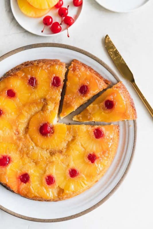 <p>Grandbaby Cakes</p><p>This is the Best Pineapple Upside Down Cake recipe ever! It’s a moist sponge cake caramelized to perfection with brown sugar pineapple rings and cherries.</p><p><strong>Get the recipe: <a href="https://grandbaby-cakes.com/pineapple-upside-down-cake/" rel="nofollow noopener" target="_blank" data-ylk="slk:Pineapple Upside Down Cake;elm:context_link;itc:0;sec:content-canvas" class="link rapid-noclick-resp">Pineapple Upside Down Cake</a></strong></p>
