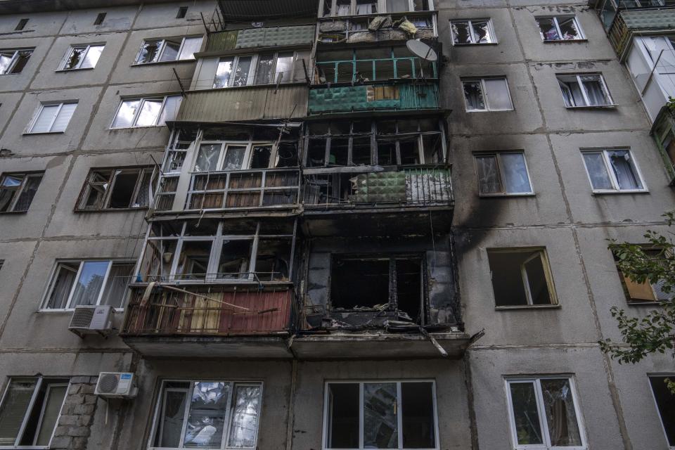 A five-story residential building damaged from a rocket attack on a residential area, in Kramatorsk, eastern Ukraine, Tuesday, July 19, 2022. (AP Photo/Nariman El-Mofty)