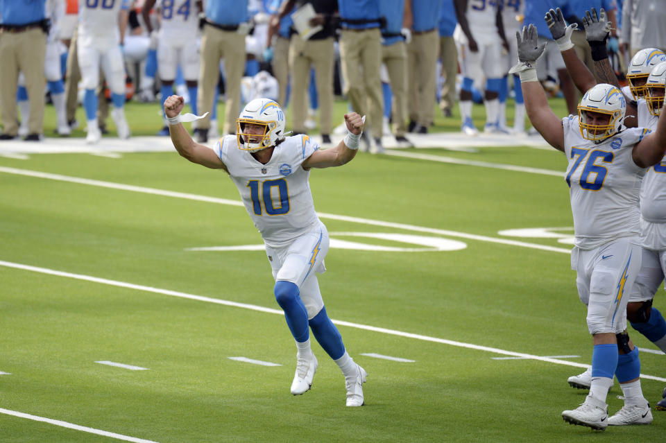 Los Angeles Chargers quarterback Justin Herbert celebrates after throwing his first career touchdown pass during the first half of an NFL football game against the Kansas City Chiefs Sunday, Sept. 20, 2020, in Inglewood, Calif. (AP Photo/Kyusung Gong)
