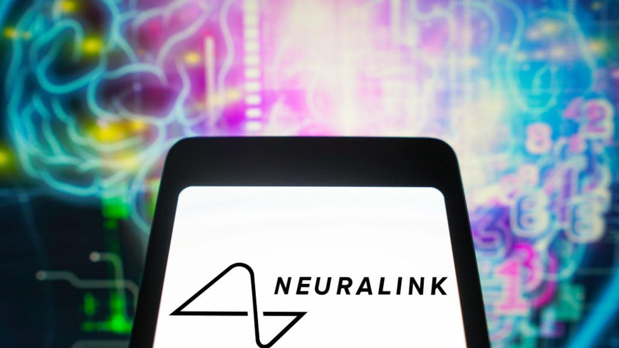  The neuralink logo in front of an abstract image of a human brain. 