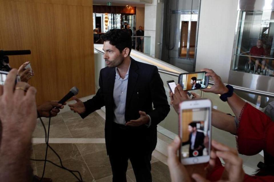 Orestes Fintiklis, manager of the Miami-based private equity fund Ithaca Capital, talks to the press in the lobby of the Trump Ocean Club International Hotel and Tower in Panama City, Monday, March 5, 2018. Escorted by police officers and a Panamanian judicial official, the owner of the Trump Panama City hotel took control of the property. A team of Trump security officials left.