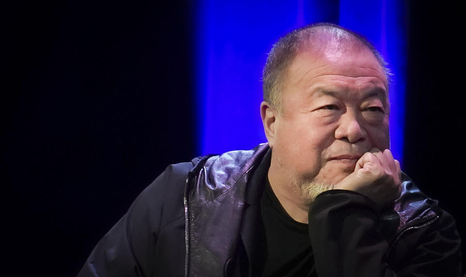 Visual artist and activist Ai Weiwei listens as he appears on stage with author Mira Jacob at The Town Hall theatre, Tuesday, Jan. 23, 2024, in New York. Ai was in New York to discuss his new book, the graphic memoir “Zodiac,” structured around the animals of the Chinese Zodiac, with additional references to cats. (AP Photo/Bebeto Matthews)