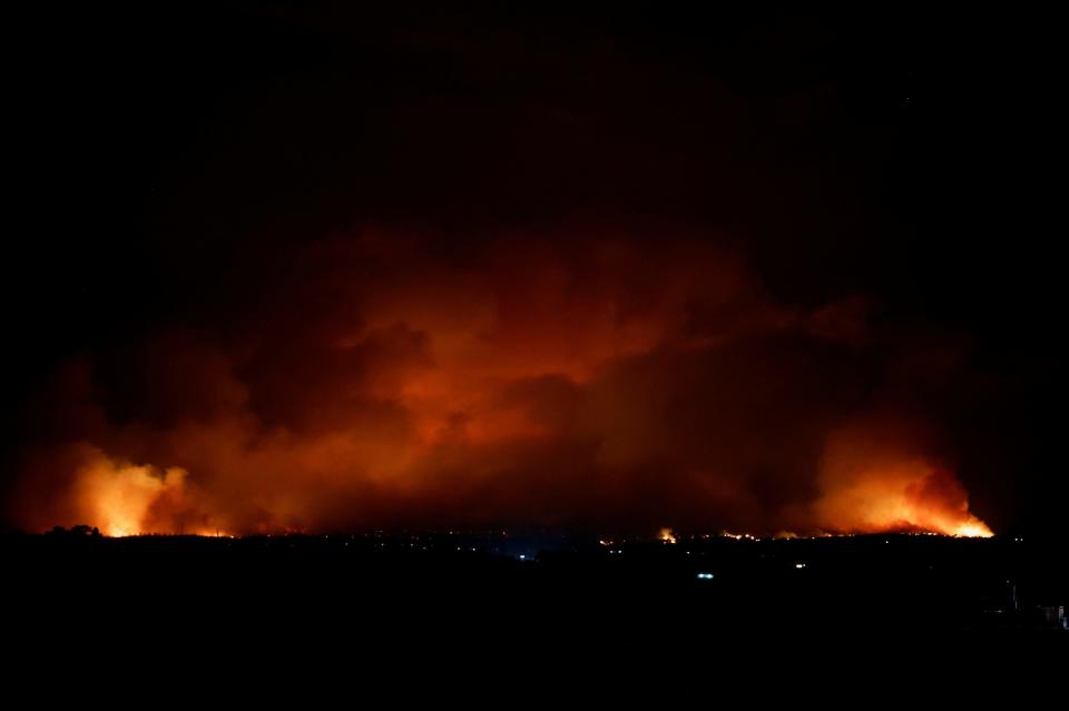 Smoke and flames rise from Park Fire burning near Chico, California, U.S., July 24, 2024. REUTERS/Fred Greaves