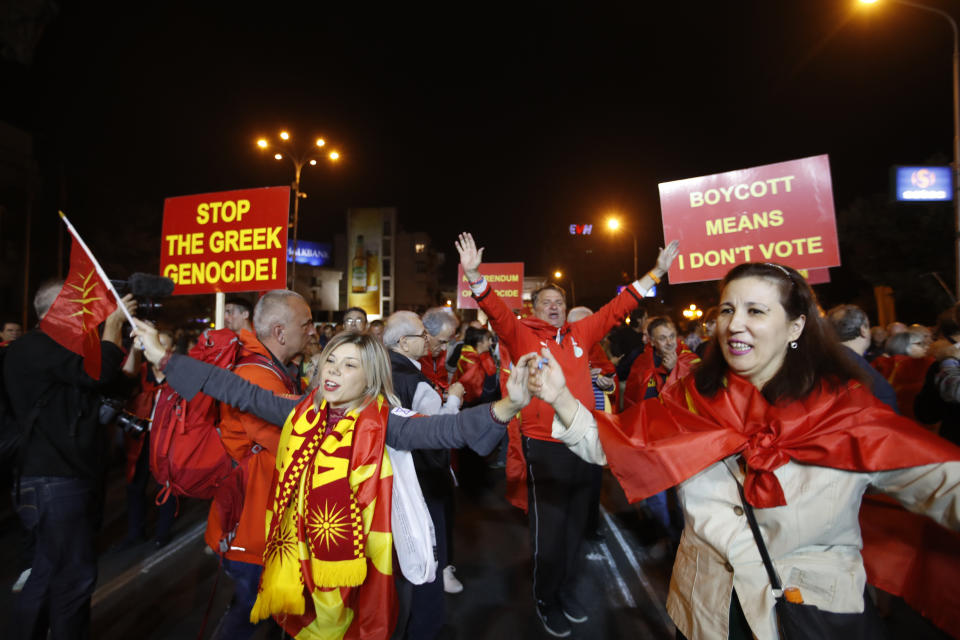 Supporters of a movement for voters to boycott the referendum, dance as they celebrate in central Skopje, Macedonia, after election officials gave low turnout figures, Sunday, Sept. 30, 2018. The crucial referendum on accepting a deal with Greece to change the country's name to North Macedonia to pave the way for NATO membership attracted tepid voter participation Sunday, a blow to Prime Minister Zoran Zaev's hopes for a strong message of support. (AP Photo/Thanassis Stavrakis)