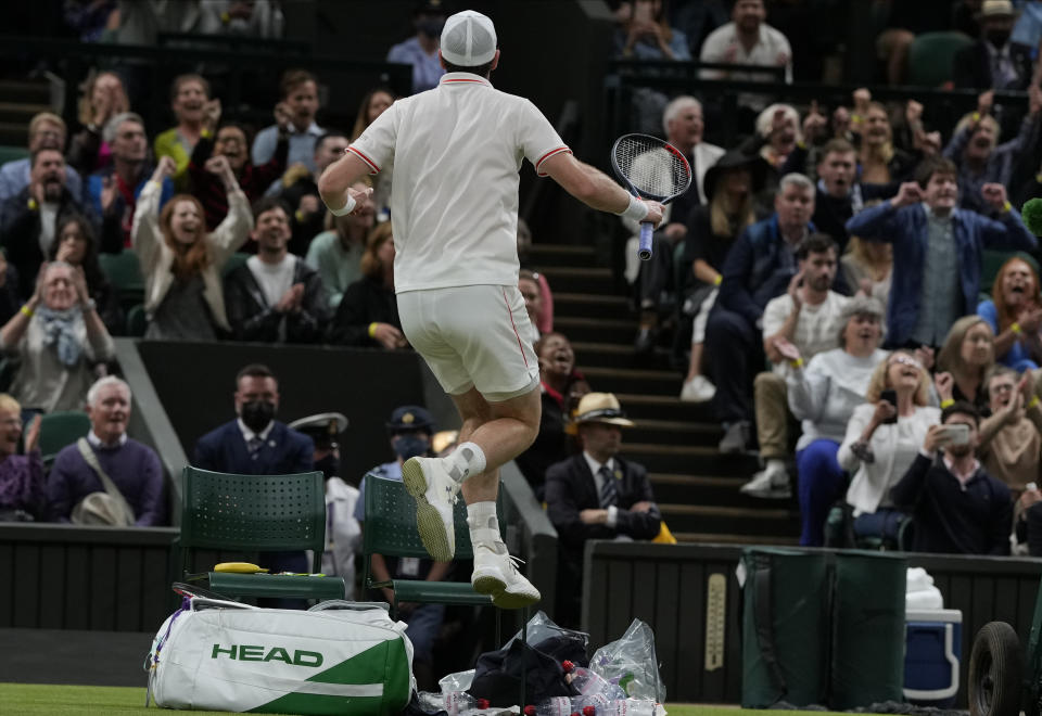 Britain's Andy Murray celebrates winning the men's singles second round match against Germany's Oscar Otteon day three of the Wimbledon Tennis Championships in London, Wednesday June 30, 2021. (AP Photo/Alastair Grant)
