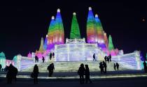 <p>Tourists enjoy spectacular ice and snow sculptures at the Harbin Ice and Snow World park in Harbin, China, on Jan. 2. (Photo: Sipa Asia/REX/Shutterstock) </p>