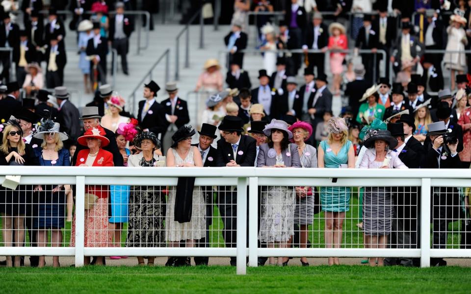 Racegoers look on from the grandstand on Ladies' Day during day three of Royal Ascot - Getty Images