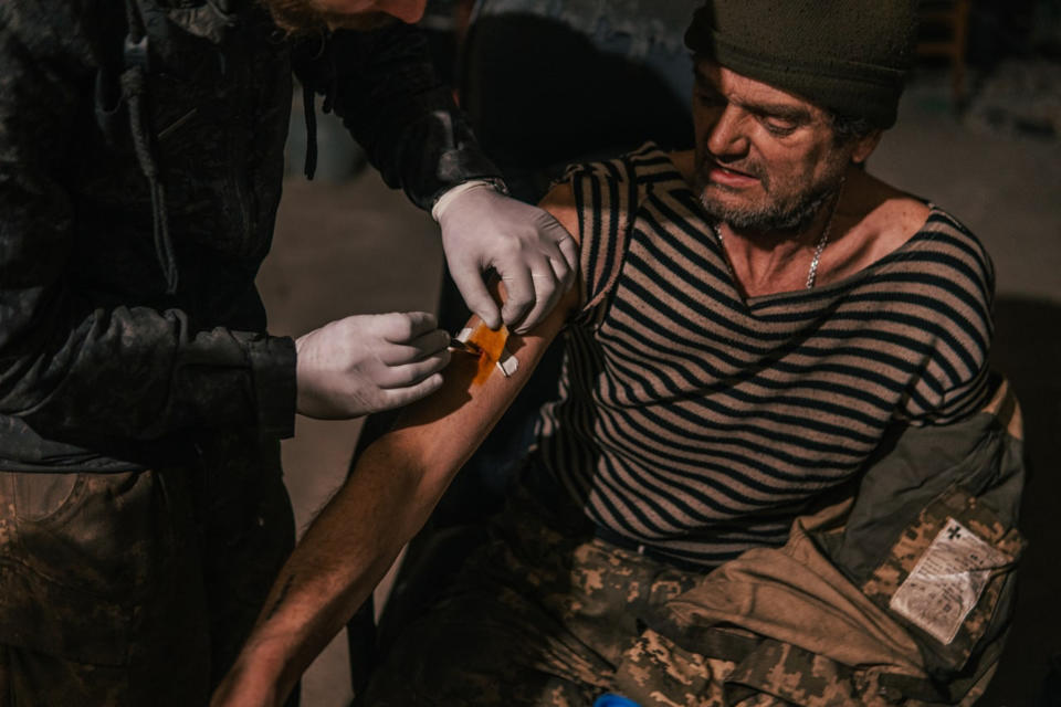 A wounded Ukrainian soldier is treated by a doctor in the Azovstal steel plant in Mariupol. (Courtesy Lt. Ilya Samoilenko)