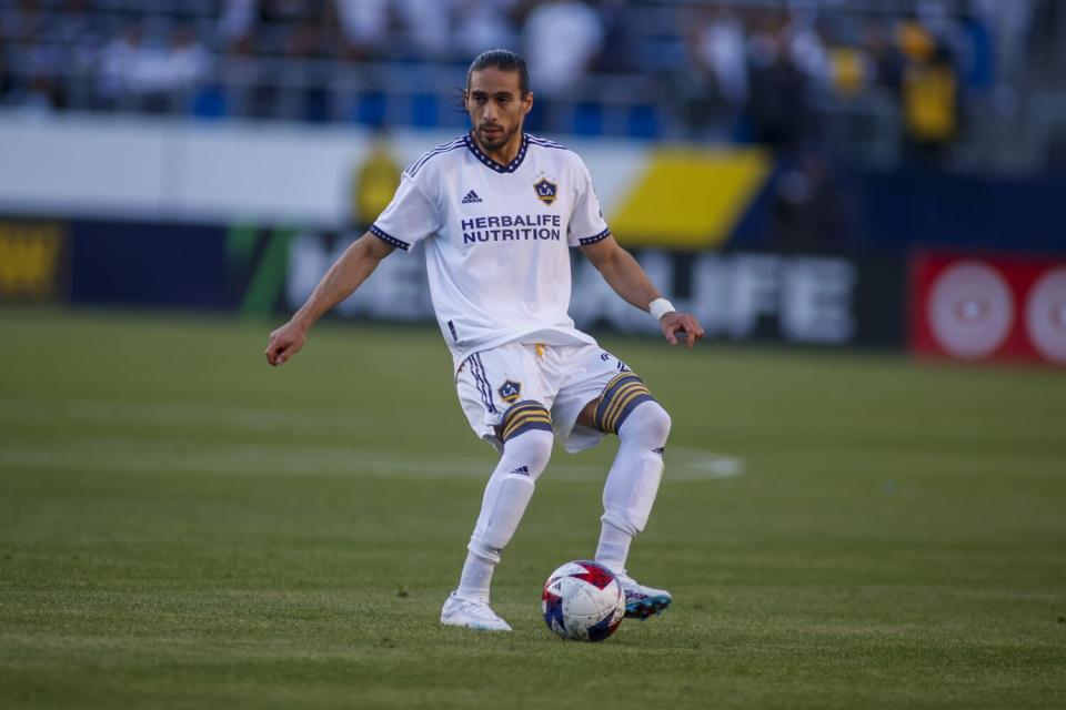 Galaxy defender Martín Cáceres controls the ball.