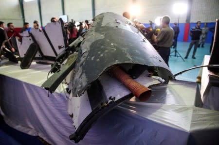 The purported wreckage of the American drone is seen displayed by the Islamic Revolution Guards Corps (IRGC) in Tehran