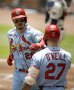 St. Louis Cardinals' Nolan Arenado, left, celebrates with Tyler O'Neill (27) after hitting a two run home run off Atlanta Braves' Bryse Wilson in the first inning of the first baseball game of a doubleheader Sunday, June 20, 2021, in Atlanta. (AP Photo/Ben Margot)