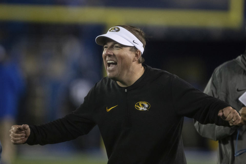 Missouri coach Eliah Drinkwitz celebrates the team's win over Kentucky in an NCAA college football game in Lexington, Ky., Saturday, Oct. 14, 2023. (AP Photo/Michelle Haas Hutchins)