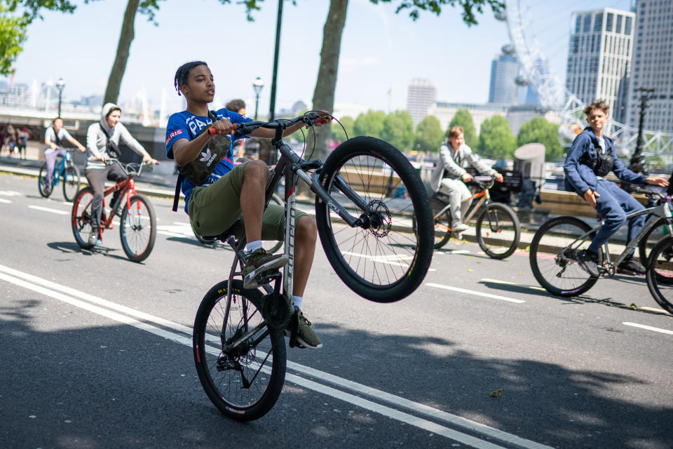 <p>A group of young men ride bicycles along Embankment, London. Picture date: Thursday June 3, 2021.</p>
