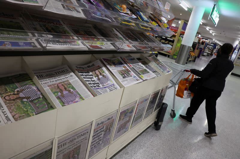 British newspapers with news of Britain's Catherine, Princess of Wales' illness are displayed at a supermarket in London