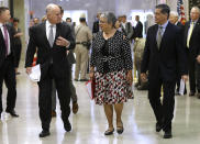 FILE - In this May 1, 2018, file photo, California Gov. Jerry Brown, left, talks with California Air Resources Board Chair Mary Nichols and California Attorney General Xavier Becerra as they walk to a news conference to discuss a lawsuit filed by 17 states and the District of Columbia over the Trump administration's plans to scrap vehicle emission standards, in Sacramento, Calif. Nichols' term leading CARB ends in December 2020. She's held the role since 2007 after an earlier stint as chair in the early 1980s. (AP Photo/Rich Pedroncelli, File)