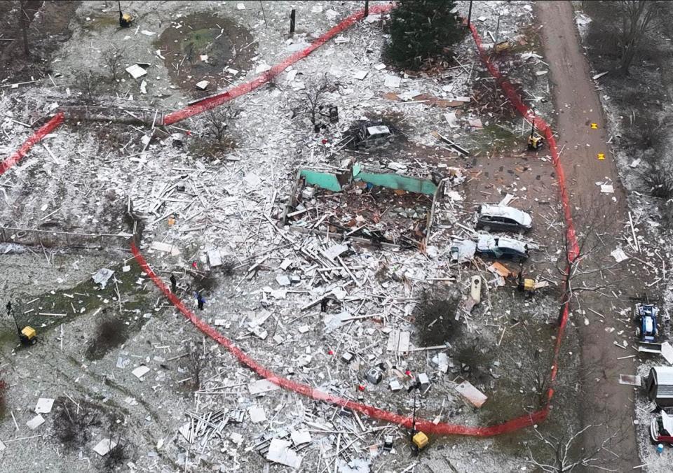 An aerial photo provided by the Northfield Township Police Department on Sunday shows the devastation from a house explosion that killed four people and critically injured two others.