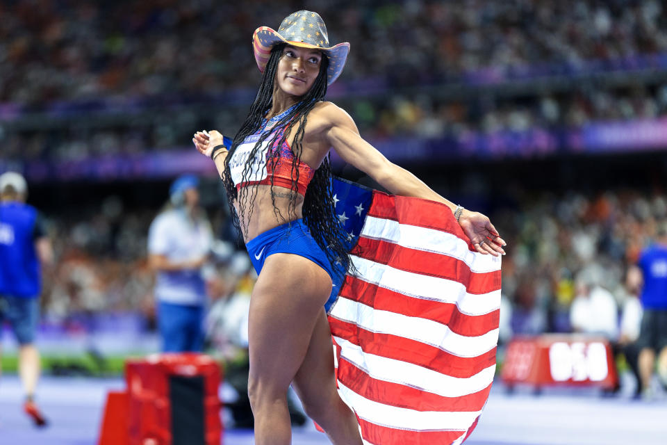 PARIS, FRANCE: AUGUST 8: Tara Davis-Woodhall of the United States celebrates winning the gold medal in the women's long jump final during the track and field event at the Stade de France during the Paris 2024 Summer Olympics on August 8, 2024 in Paris, France. (Photo by Tim Clayton/Corbis via Getty Images)