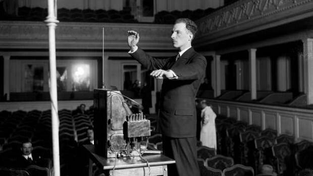 Lev Theremin demonstrates his invention.