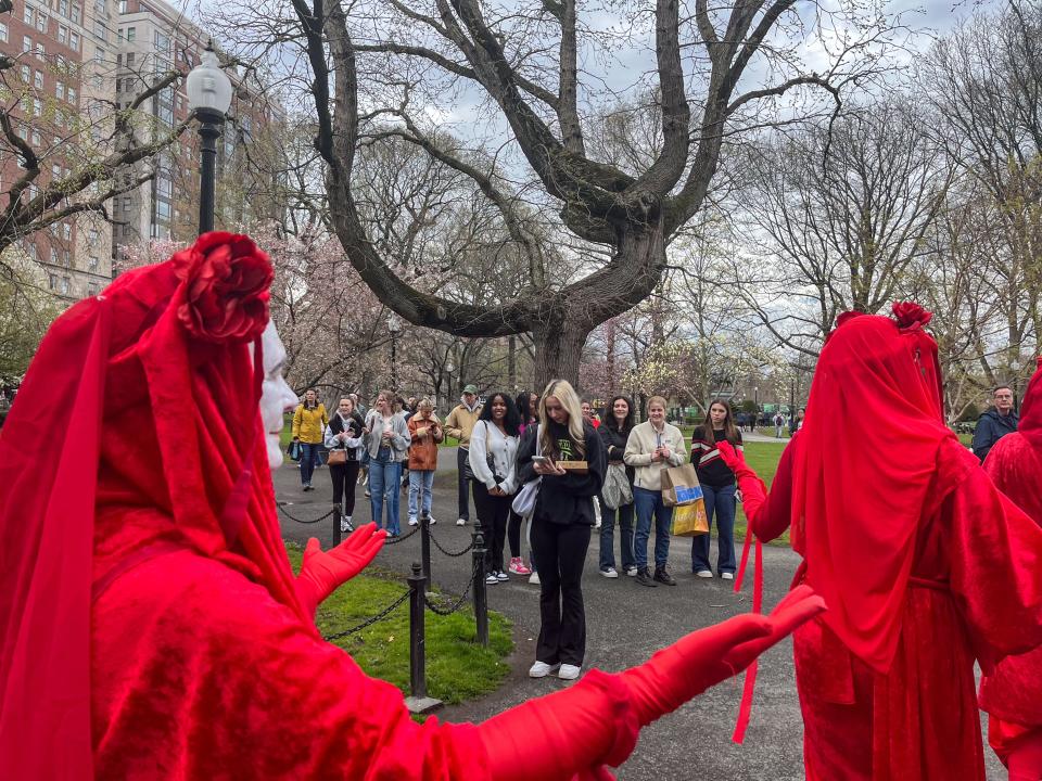 Members of Extinction Rebellion march on the Boston Common to protest climate change, April 21, 2024.