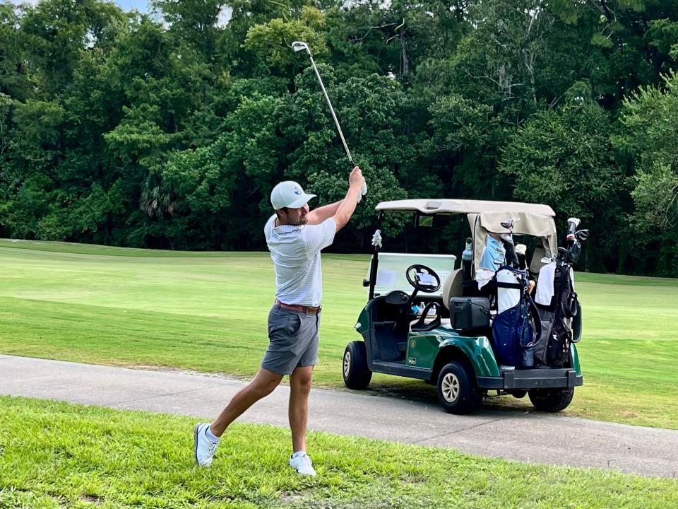 Johnny Watts hits from the rough at Deerwood's par-5 18th hole on Friday during the second round of the Jacksonville Amateur. It was the only fairway he missed in shooting a 67 to get into contention.