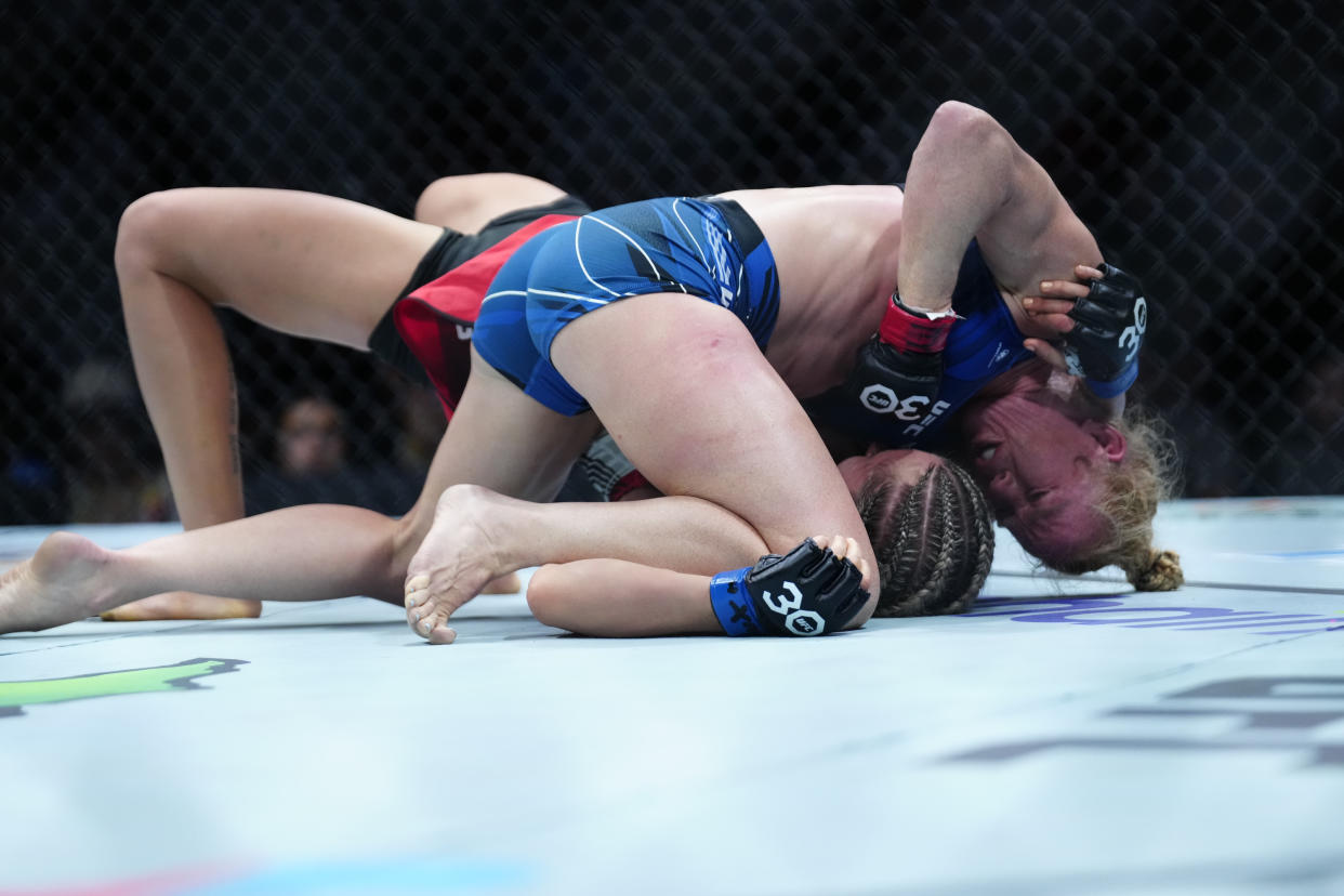 SAN ANTONIO, TEXAS - MARCH 25: Holly Holm (top) controls the body of Yana Santos in their Women's Bantamweight fight during the UFC on ESPN 43 event at AT&T Center on March 25, 2023 in San Antonio, Texas, USA. (Photo by Louis Grasse/PxImages/Icon Sportswire via Getty Images)