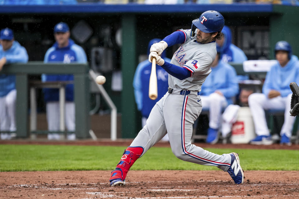 Texas Rangers third base Josh Smith makes contact with the ball during the fifth inning of a baseball game against the Kansas City Royals, Sunday, May 5, 2024, in Kansas City, Mo. (AP Photo/Nick Tre. Smith)